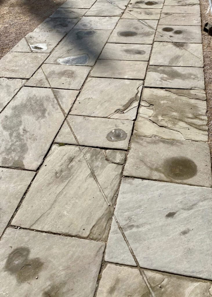 Lines of city wall marked on paving behind the Clarendon Building